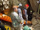 Divers have been navigating flooded sections of the cave to look for survivors. 