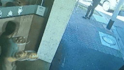 A Melbourne cafe worker has had her tooth chipped after a random woman smashed a tray of food into her face in a shocking unprovoked attack that has since gone viral.