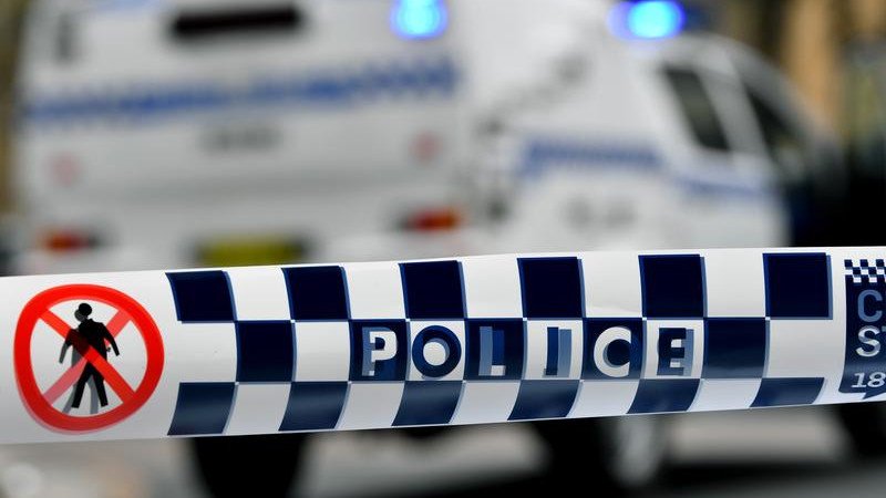 A man has been charged after allegedly threatening staff at a medical facility while carrying firearms.