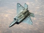 A US Air Force F-22 Raptor stealth fighter is refuelled while flying over the Middle East.