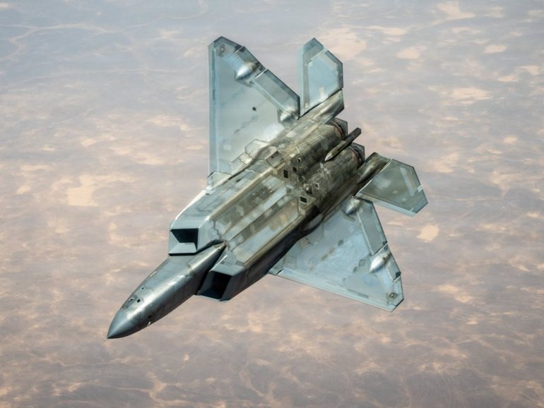 A US Air Force F-22 Raptor stealth fighter is refuelled while flying over the Middle East.