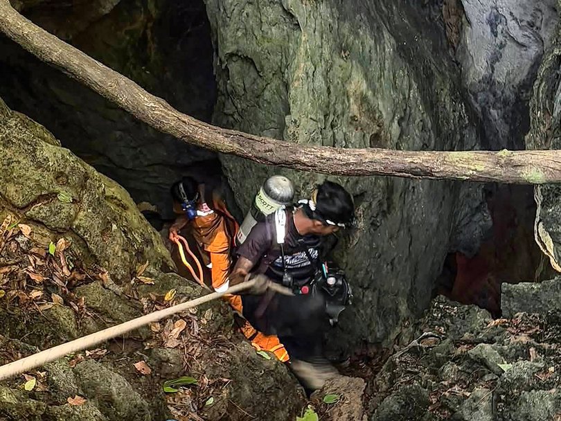 Rescue workers enter the cave in Xaisomboun province. 