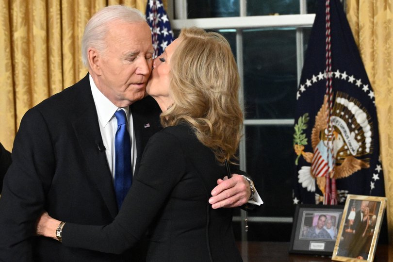 First Lady Jill Biden kisses husband, US President Joe Biden.