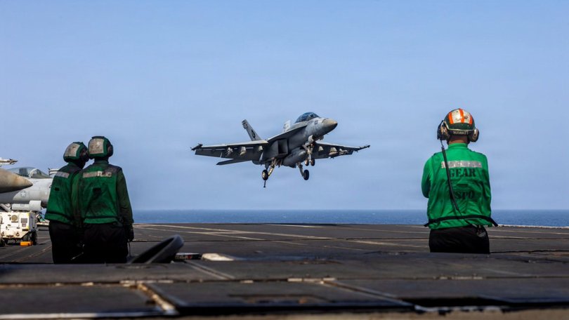 A US aircraft lands on USS Abraham Lincoln.