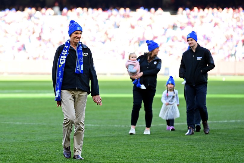 Neale Daniher walks through a guard of honour.