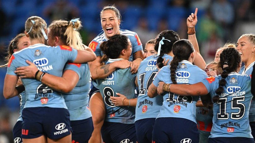 History: NSW players celebrate a first clean sweep in the women's State of Origin series. (Dave Hunt/AAP PHOTOS)