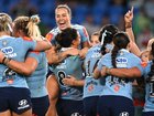 History: NSW players celebrate a first clean sweep in the women's State of Origin series. (Dave Hunt/AAP PHOTOS)