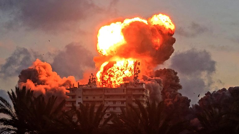 A fireball erupts from a building following an Israeli strike in Tyre, southern Lebanon.