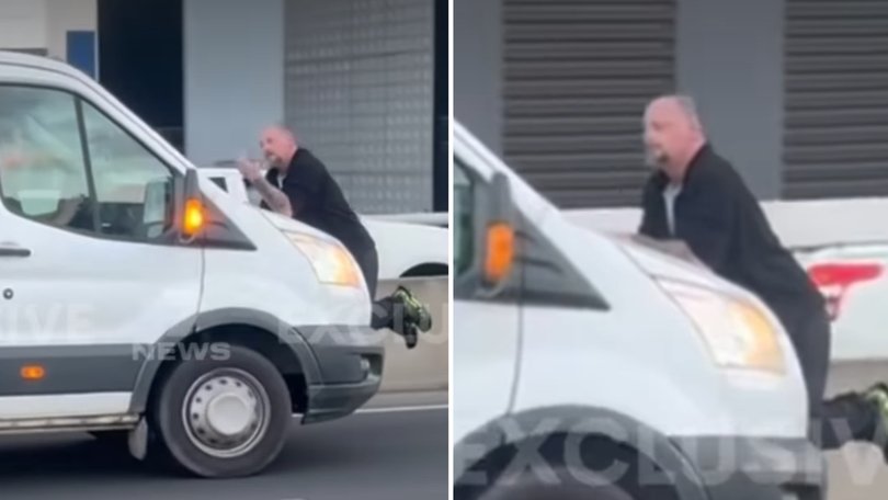 Road rage horror as man dangles from moving van.