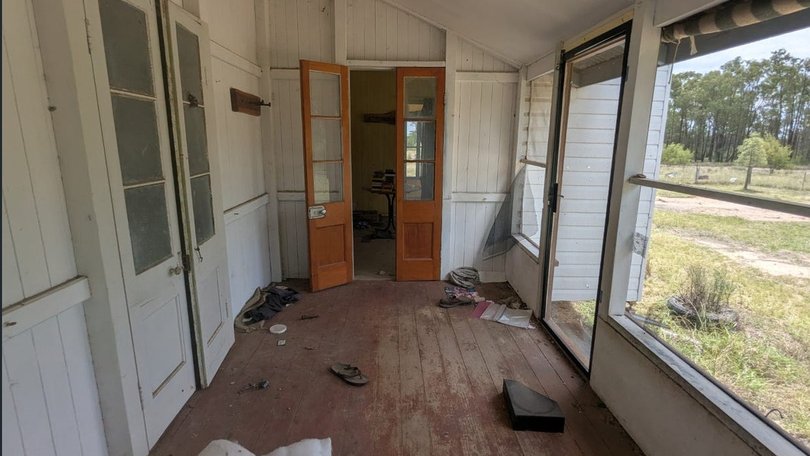 The enclosed verandah of the house where Stacey Gareth and Nathaniel Train lived and where officers were ambushed.