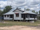 Families of slain police are outraged at the sale of the two-bedroom home where of one of Australia’s worst police tragedies took place.