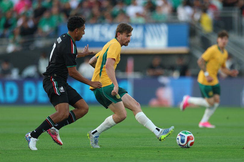 PASADENA, CALIFORNIA - MAY 30: Connor Metcalfe of Australia shoots against Luis Romo of Mexico during the international friendly match between Mexico and Australia at Rose Bowl Stadium on May 30, 2026 in Pasadena, California. (Photo by Harry How/Getty Images)