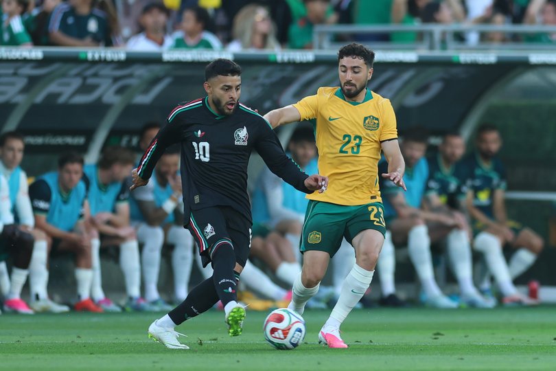 Alexis Vega of Mexico controls the ball against Jacob Italiano.