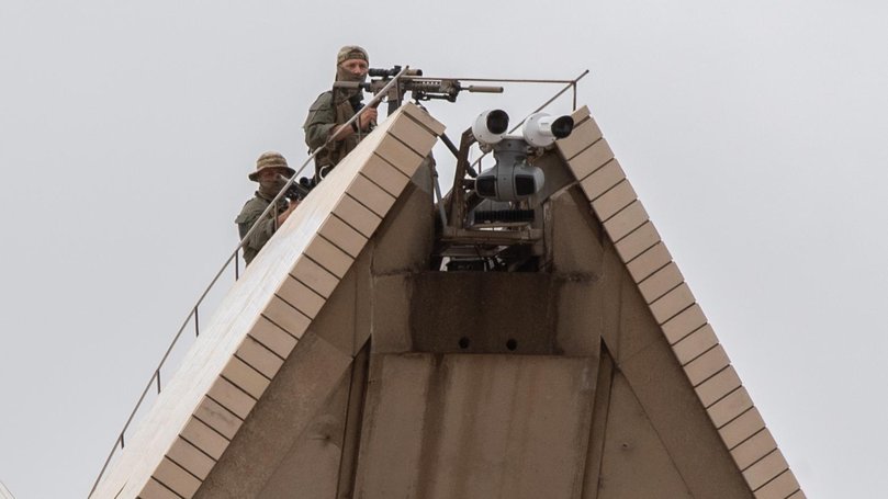 Snipers pictured on top of the sails of Sydney Opera House. Picture NewsWire / Monique Harmer