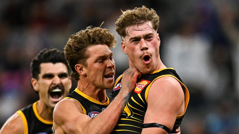 West Coast stars Milan Murdock and Harley Reid celebrate a goal.