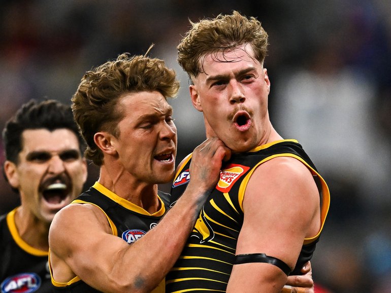 West Coast stars Milan Murdock and Harley Reid celebrate a goal.