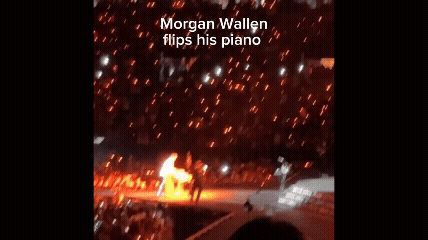 Morgan Wallen flips piano onstage.