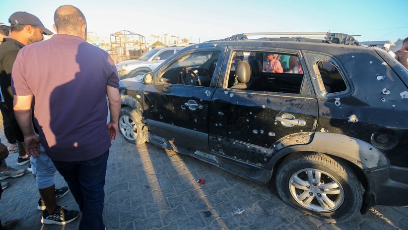 Palestinians inspect the damage after an Israeli airstrike in Gaza's port.