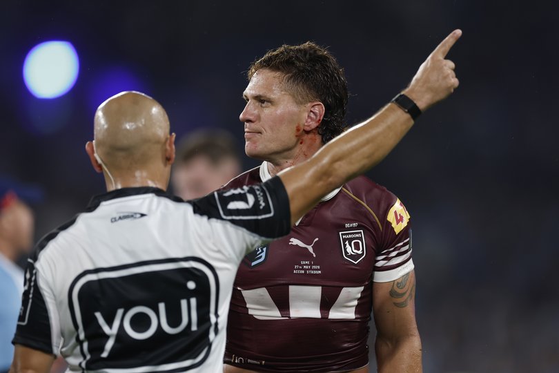 Kalyn Ponga of the Maroons is sent from the field by referee Ashley Klein.