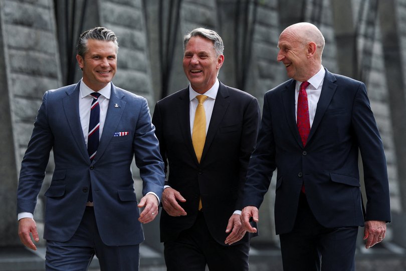 Australian Defence Minister Richard Marles, British Defence Secretary John Healey, and U.S. Secretary of Defense Pete Hegseth walk together ahead of an AUKUS Defence ministers' press huddle at the U.S. Embassy in Singapore, May 30, 2026. REUTERS/Edgar Su