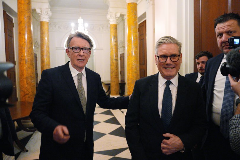 British Prime Minister Keir Starmer, right, talks with Britain's ambassador to the United States Peter Mandelson during a welcome reception at the ambassador's residence on February 26, 2025 in Washington, DC. 