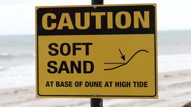 Signs warning of “soft sand” are set up every time sand is trucked onto North Glenelg beach. Picture: Eleni Tzanos