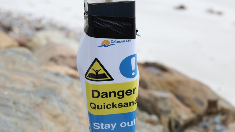 New signs have popped up on Glenelg North Beach warning of quicksand. Picture: Eleni Tzanos
