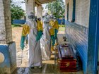 Health workers disinfect a coffin containing the body of a man presumed to have died of Ebola at a hospital in Mongbwalu, Democratic Republic of Congo, May 25, 2026. 