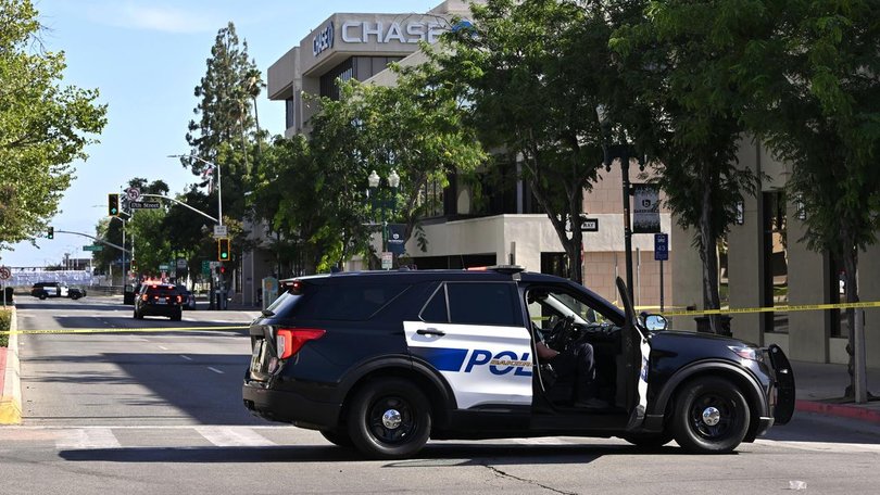 Police are trying to negotiate with a man who has taken a number of hostages at a California bank. (AP PHOTO)