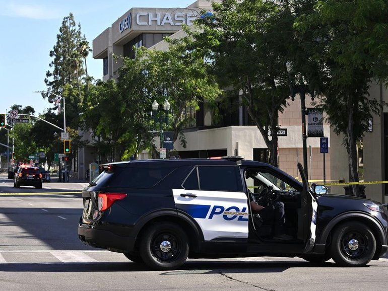 Police are trying to negotiate with a man who has taken a number of hostages at a California bank. (AP PHOTO)