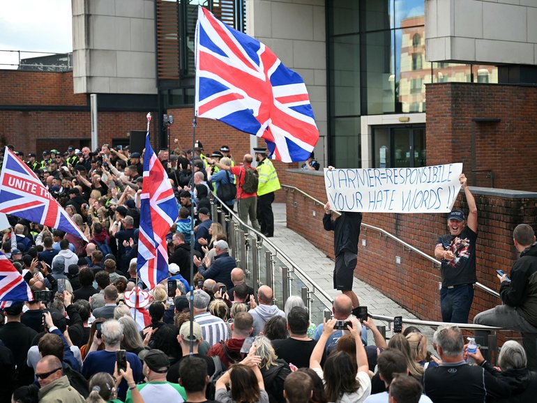 Demonstrators protest about the police's handling of the detention of victim Henry Nowak, outside Southampton Central Police Station.