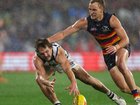 Skipper Jordan Dawson (r) was inspirational for Adelaide as they pipped Geelong in a thriller. (Matt Turner/AAP PHOTOS)