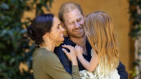 Meghan Markle and Prince Harry pictured with their daughter Lilibet in an online post celebrating her birthday.