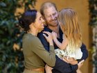Meghan Markle and Prince Harry pictured with their daughter Lilibet in an online post celebrating her birthday.
