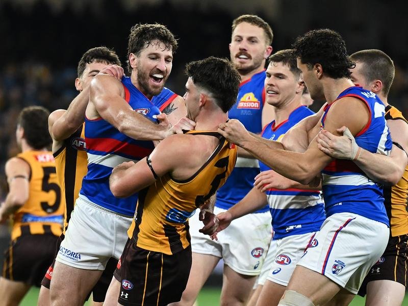 Marcus Bontempelli and the Bulldogs have edged Hawthorn in a tense and spirited AFL clash.