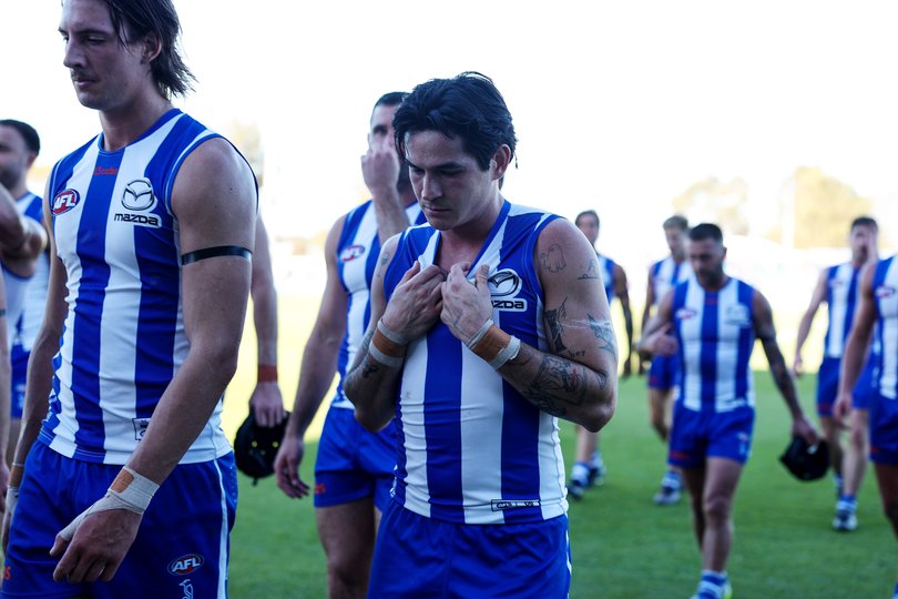 Roos players take in the loss.