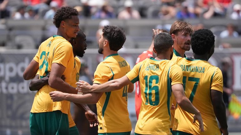 The Socceroos celebrate their goal by Tete Yengi (l) in a 1-1 draw with Switzerland. (AP PHOTO)