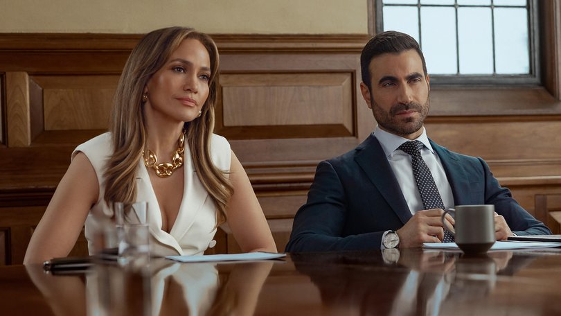 Jennifer Lopez as Jackie Cruz and Brett Goldstein as Daniel Blanchflower in Office Romance.