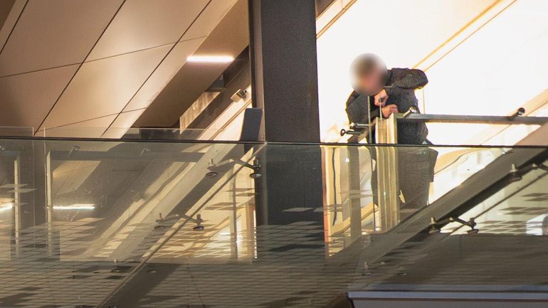 A man linked to the Chinese consulate watches a gathering in Perth’s Murray Street Mall on June 4 to remember victims of China’s Tiananmen square massacre.