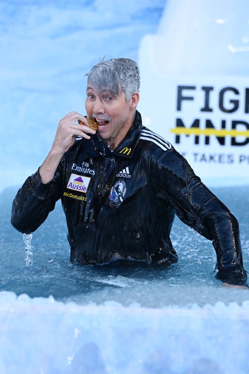 MELBOURNE, AUSTRALIA - JUNE 08: Dale Thomas goes down the slide as Mick Malthouse for FightMND Big Freeze 12 ahead of the round 13 AFL match between Collingwood Magpies and Melbourne Demons at Melbourne Cricket Ground, on June 08, 2026, in Melbourne, Australia. (Photo by Quinn Rooney/Getty Images)