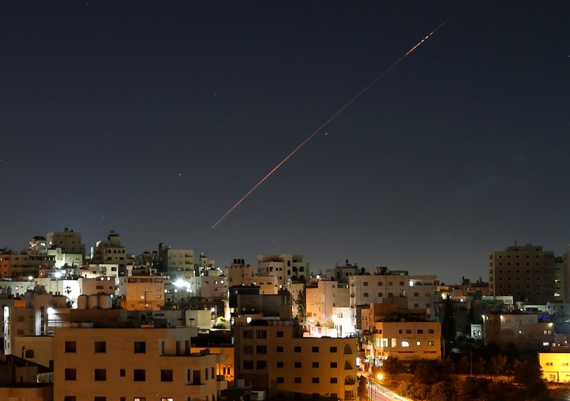 Missiles launched from Iran toward Israel are seen in the sky over the West Bank city of Hebron on June 7, 2026. 