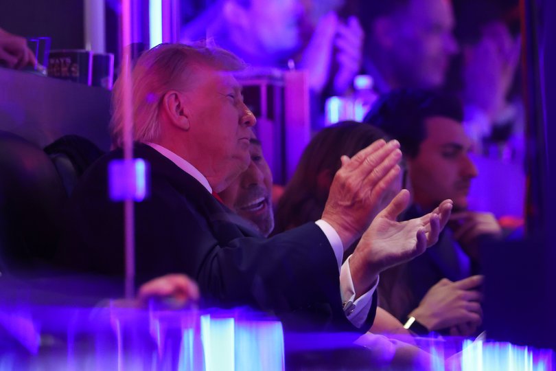 Trump watching on.