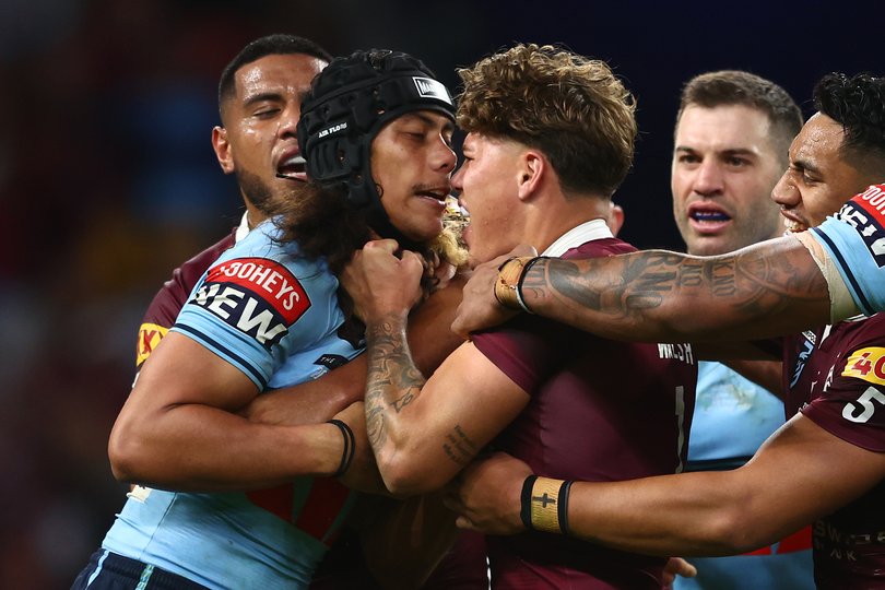 Jarome Luai and Reece Walsh tussle in 2023.