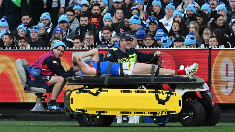 Brody Mihocek was stretchered off the MCG after fracturing his neck. (James Ross/AAP PHOTOS)