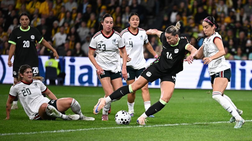 Australia's Alanna Kennedy swivels before scoring against Mexico in the friendly in Sydney. (Dan Himbrechts/AAP PHOTOS)