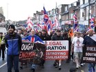 Demonstrators march along Portswood Road in Southampton, England, on Tuesday, June 9, 2026, during an Enough is Enough protest, after a man from Sudan was arrested over a knife attack in Belfast. (Andrew Matthews/PA via AP)