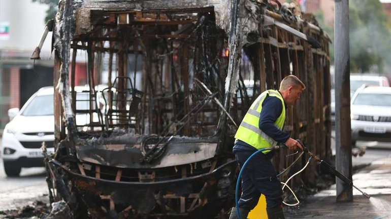 Belfast has woken to scenes of charred homes and cars after a night of anti-immigrant rioting. 
