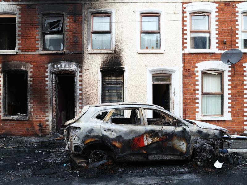 Belfast has woken to charred homes and vehicles after a night of anti-immigrant rioting.