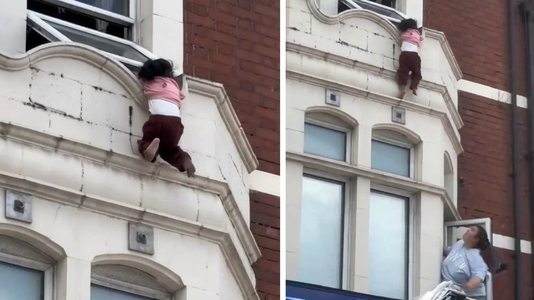 Terrifying moment toddler holds on for life outside second story window.