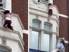 Terrifying moment toddler holds on for life outside second story window.